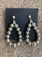 Navajo Pearl inspired sterling silver embossed bead earrings, star pattern