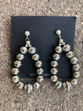 Navajo Pearl inspired sterling silver embossed bead earrings, star pattern