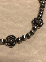 Sterling Silver necklace in oxidized beads and lotus flower beads.  Adjustable length from 15” to 17”. SR147