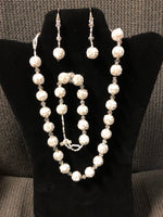 Glass bead balls in a necklace, earrings, and bracelet set.