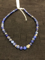 Genuine Lapis with sterling silver in an adjustable length from 15-18”. SR133