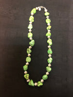 Green turquoise necklace in 17.5” length.  The stones are dyed to resemble natural  Gaspeite.  The stones are alternated  with  Navajo hand soldered sterling silver  beads .   A.S.   GT-1 FREE SHIPPING IN THE CONTINENTAL USA.