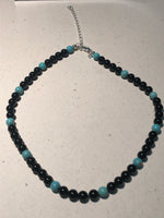 Genuine Black Onyx and turquoise 6mm beads with sterling silver in a 14” to 16” choker length.  SR 132