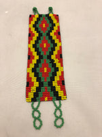 Guatemalan made glass bead  bracelet in yellow, red, green and black.  Rasta colors