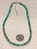 Genuine Turquoise and sterling silver choker style necklace with alternating saucer beads.  14” to 16” length SR135