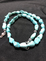 Genuine Campitos Turquoise in matte finish and natural light blue color in a necklace