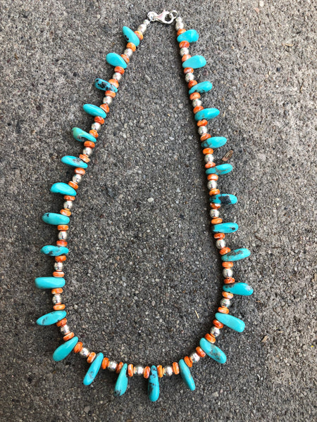 A sterling silver necklace with genuine turquoise and rare Spiney oyster shell.
