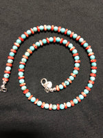 Natural turquoise round bead and Spiney oyster shell disc necklace in 18” length.  Sterling silver lobster claw clasp