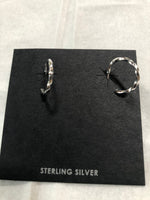 Twisted sterling silver hoop style earrings with posts. PS5