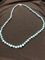 Persian style natural  turquoise With alternating sterling silver beads. 27” long