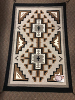 Authentic Navajo handwoven wool rug.  31” x 48”. Woven by Rena BeGaye