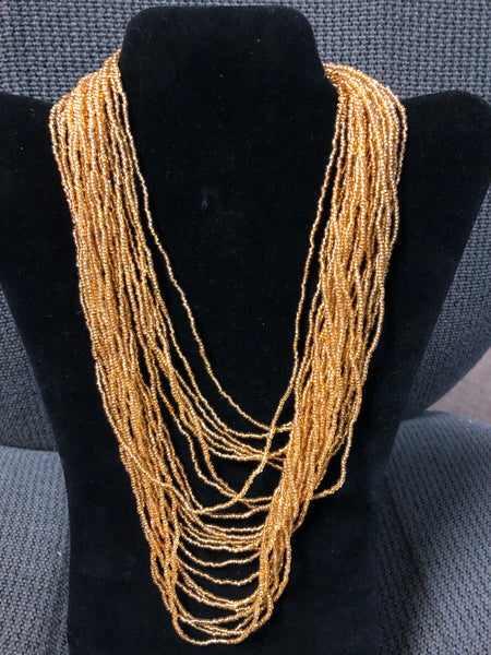 gold color multi strand glass beads hand made.