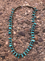 Genuine and natural color Campitos turquoise teardrop necklace with etched Aztec design sterling silver beads and lobster claw clasp. 25”.  A.S.    CAMP-2 FREE SHIPPING IN THE CONTINENTAL USA.