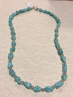 Campitos turquoise in a matte finish with sterling silver fashioned into a 20” necklace.  SR115 FREE SHIPPING IN THE CONTINENTAL USA.
