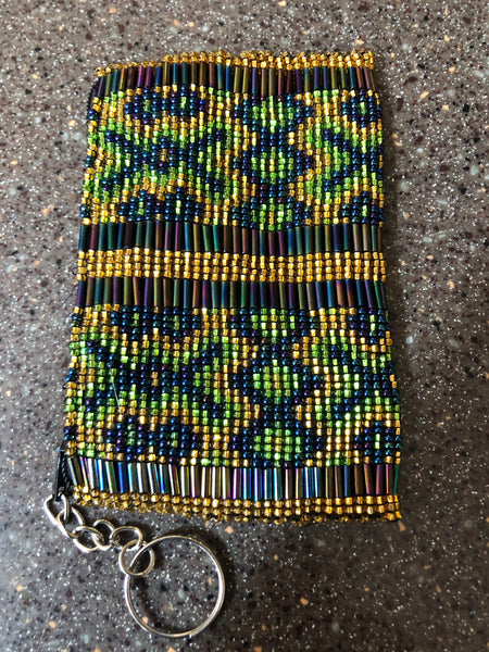 Change purse hand beaded on both sides using glass beads.