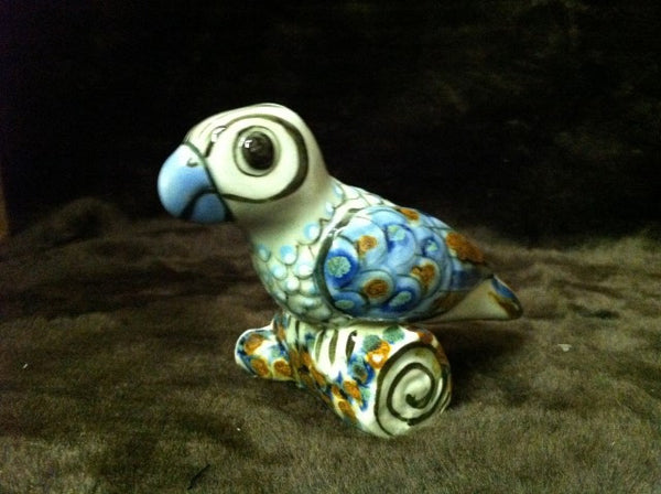 Small parrot figurine in stoneware.