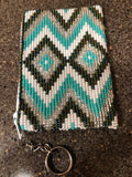 Coin bag beaded on both sides with glass beads and a key ring.