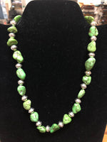 Green turquoise necklace in 17.5” length.  The stones are dyed to resemble natural  Gaspeite.  The stones are alternated  with  Navajo hand soldered sterling silver  beads .   A.S.   GT-1 FREE SHIPPING IN THE CONTINENTAL USA.