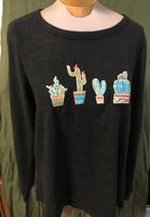 Sweat shirt style with applique cactus on bust line.
