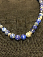 Genuine Lapis with sterling silver in an adjustable length from 15-18”. SR133