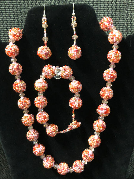 Glass bead balls in a necklace, earrings, and bracelet set.