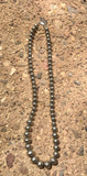 Navajo Pearl style sterling silver bead necklace in 4 sizes of beads, decorated with flowers in a 20” length.  By A.S.   AS613