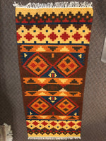 Handwoven wool rug in a 2.5’ x 6’ size.  Shree 114