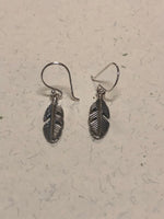 Sterling silver feather earrings. PS19