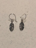 Sterling silver feather earrings. PS19