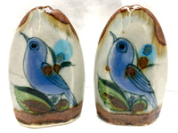Ken Edwards stoneware pottery salt and pepper shakers with brown rim and blue and green ornamentation, birds or butterfly with leaves.