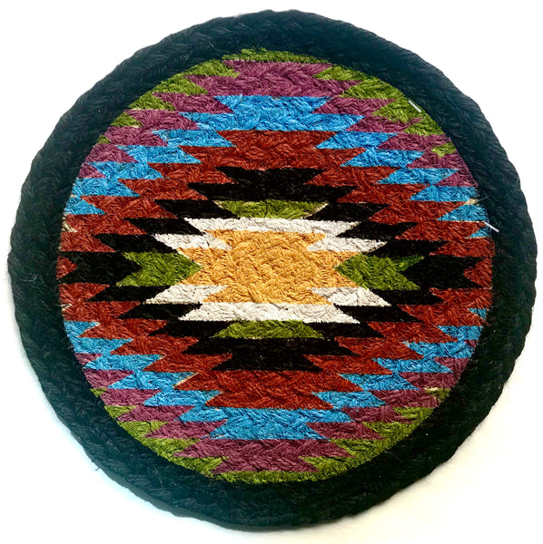 Round hand braided coaster in 10" size with black border and Navajo rug style stencil in the middle.