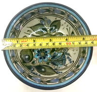 This 5" Ken Edwards collection series dessert bowl or can be used as an individual vegetable serving bowl. It is natural grey clay color background with birds, butterflies, and leaves in blue, green, black and brown on the outside.