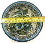 This 5" Ken Edwards collection series dessert bowl or can be used as an individual vegetable serving bowl. It is natural grey clay color background with birds, butterflies, and leaves in blue, green, black and brown on the outside.