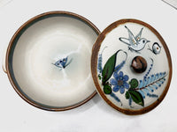 Casserole dish with brown rim on top and bottom, two pieces.