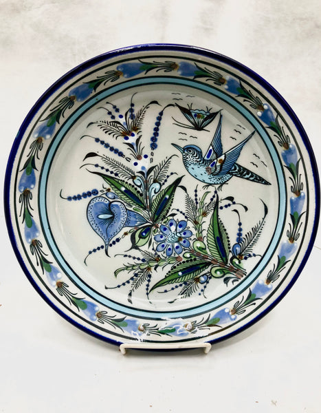 Blue rim with birds and butterfly in center