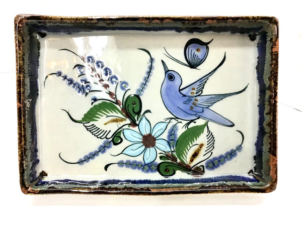 Ken Edwards Pottery rectangular tray with brown rim and bird, butterfly, flower, and leaf designs.