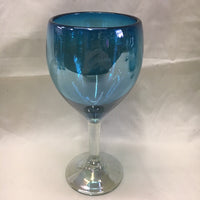 Hand blown glass in solid aquamarine color with  clear glass stem and foot.