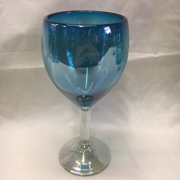 Hand blown glass in solid aquamarine color with  clear glass stem and foot.