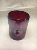Hand blown glass in solid red color and pinched sides for comfort while drinking.