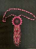 Colorful dreamcatcher in glass bead necklace.
