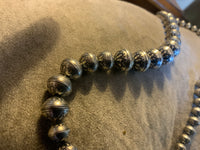Navajo Pearl style sterling silver bead necklace in 4 sizes of beads, decorated with flowers in a 20” length.  By A.S.   AS613