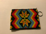 Handcrafted beadwork on both sides of change purse with Star pattern