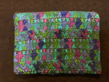 Guatemalan vintage fabric (embroidered) made into a 7” x 10” fully lined bag with zipper.  Both sides are of the same fabric.