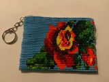 Handcrafted beadwork on both sides of change purse with Flowers and blue