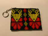 Handcrafted beadwork on both sides of change purse with Two deer.