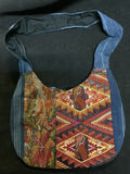 Guatemalan vintage huipil fabric made into a shoulder purse. 11” wide by 7” at its narrowest point. Note the strap is not full length and is for upper shoulder.